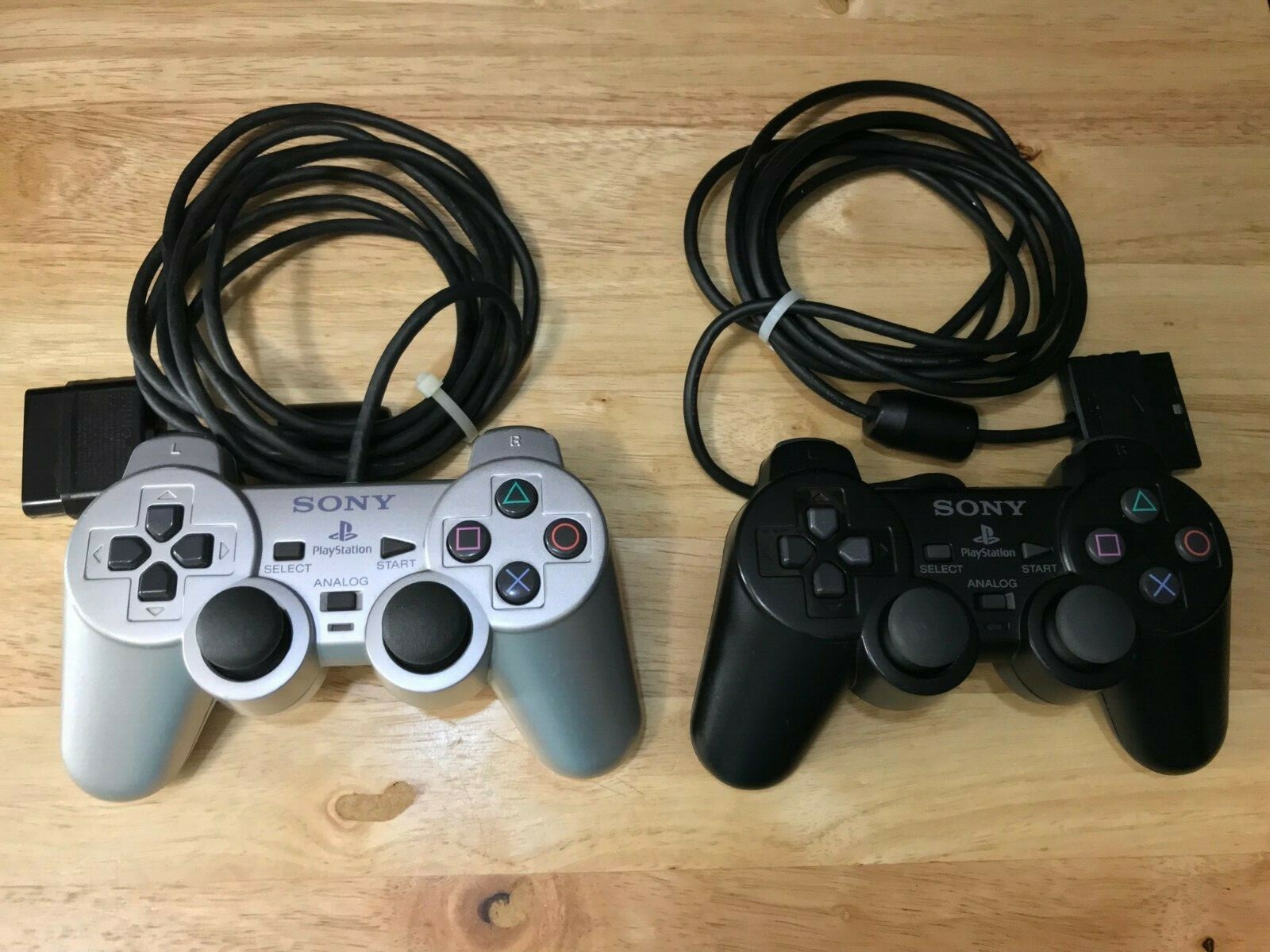 Two Dualshock Playstation 2 Controllers For Parts Only. Both are Defective