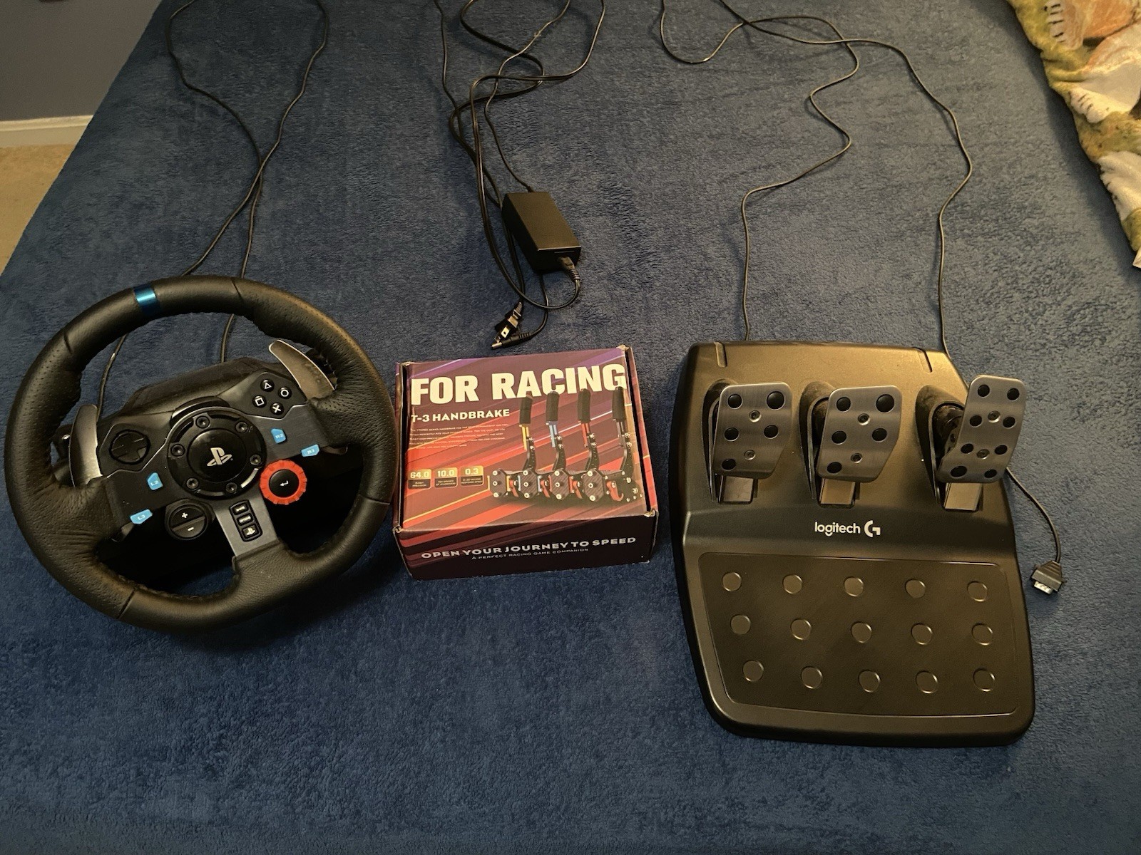 Logitech G29 Racing Wheel + Pedals + USB Handbrake (PS4/PS5/PC)
