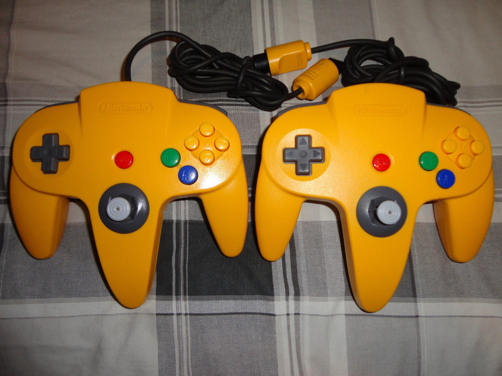 (2) N64 NINTENDO 64 controller ,yellow, red, gray, black, purple, blue, ORIGINAL