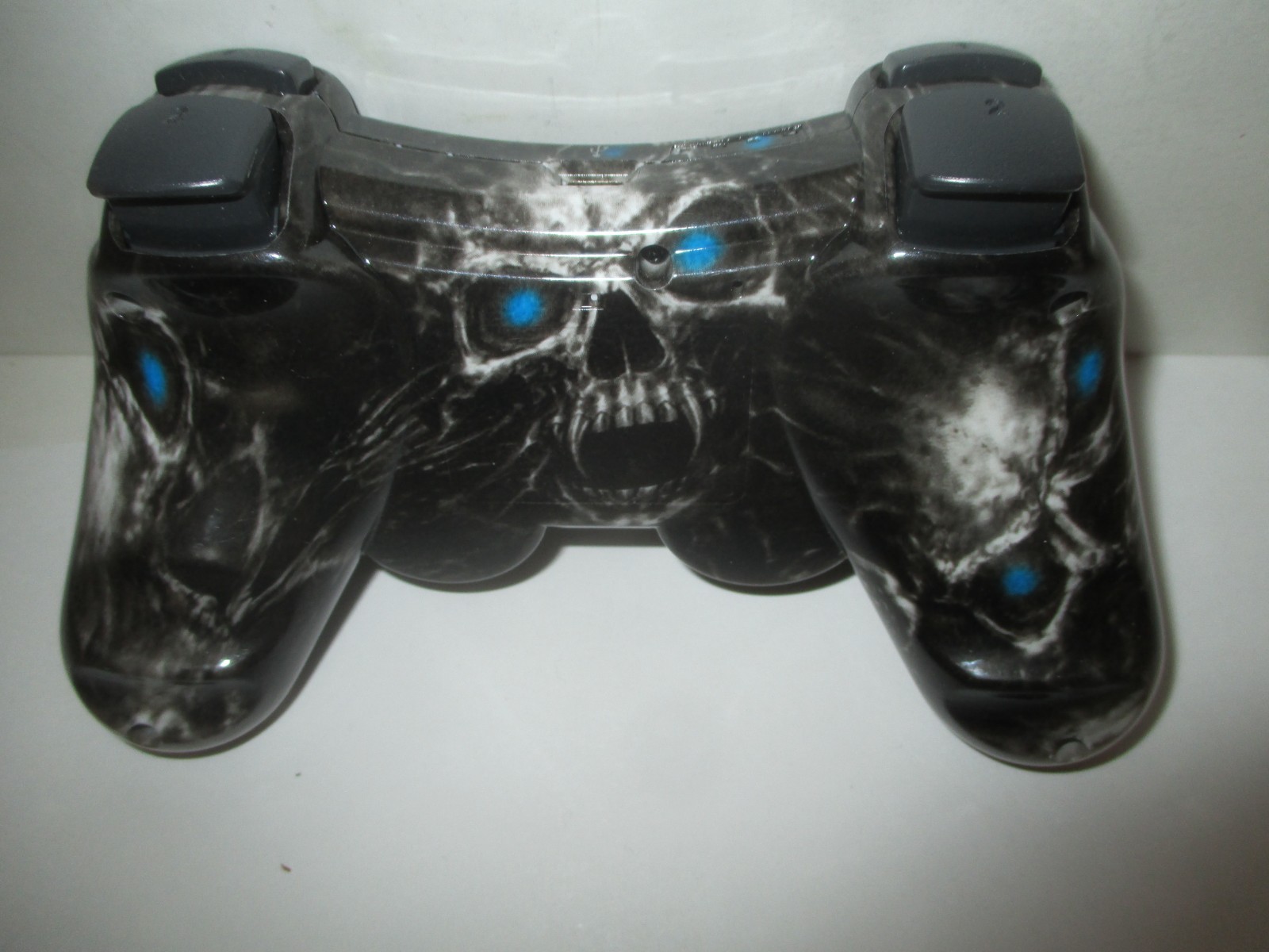 PAIR PLAYSTATION 3 PS3 3RD PARTY CONTROLLERS BLACK SKULL RED COSMOS+CORDS AS IS