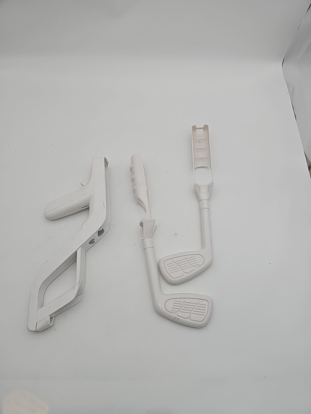 Used Wii Zapper shell and 2 golf club attachments. Great for Wii Sports & more.