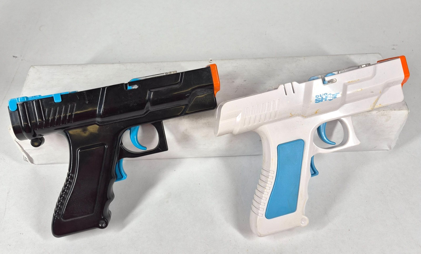 Lot 2 Nintendo Wii Duo Shot Pistol Gun Controller Shells Blue Orange 1617
