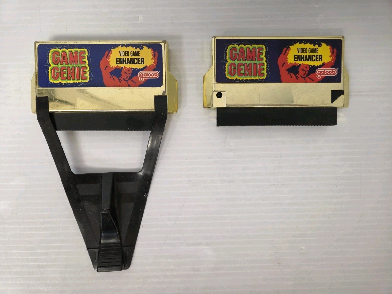 Lot of 2 Nintendo NES Game Genie – For Parts or Repair – Untested – Galoob